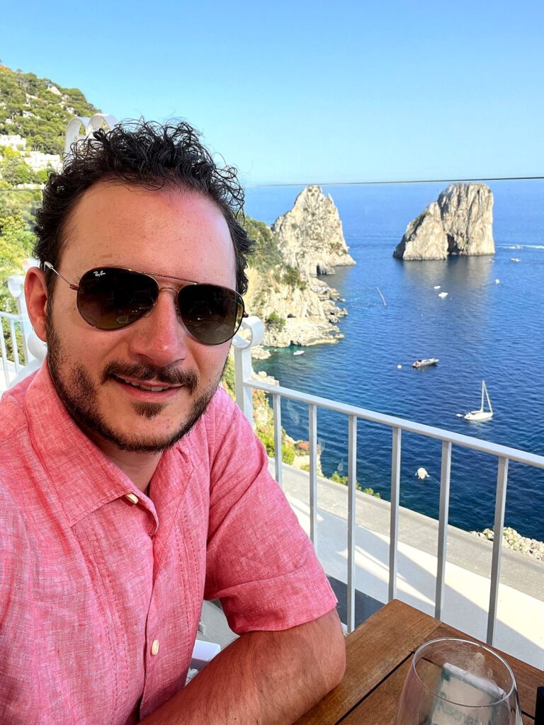 Aperitivo with a view of the Faraglioni sea rocks at Capri Rooftop