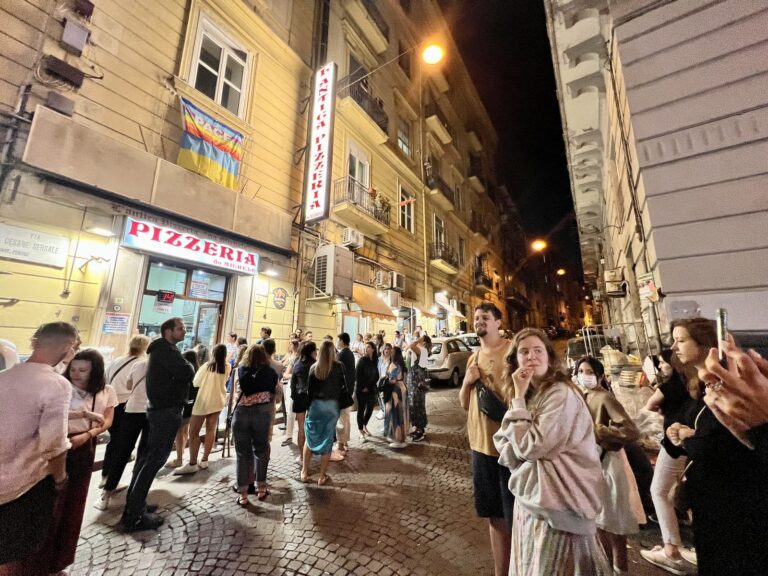The crowd waiting outside Antica Pizzeria da Michele in Naples at night