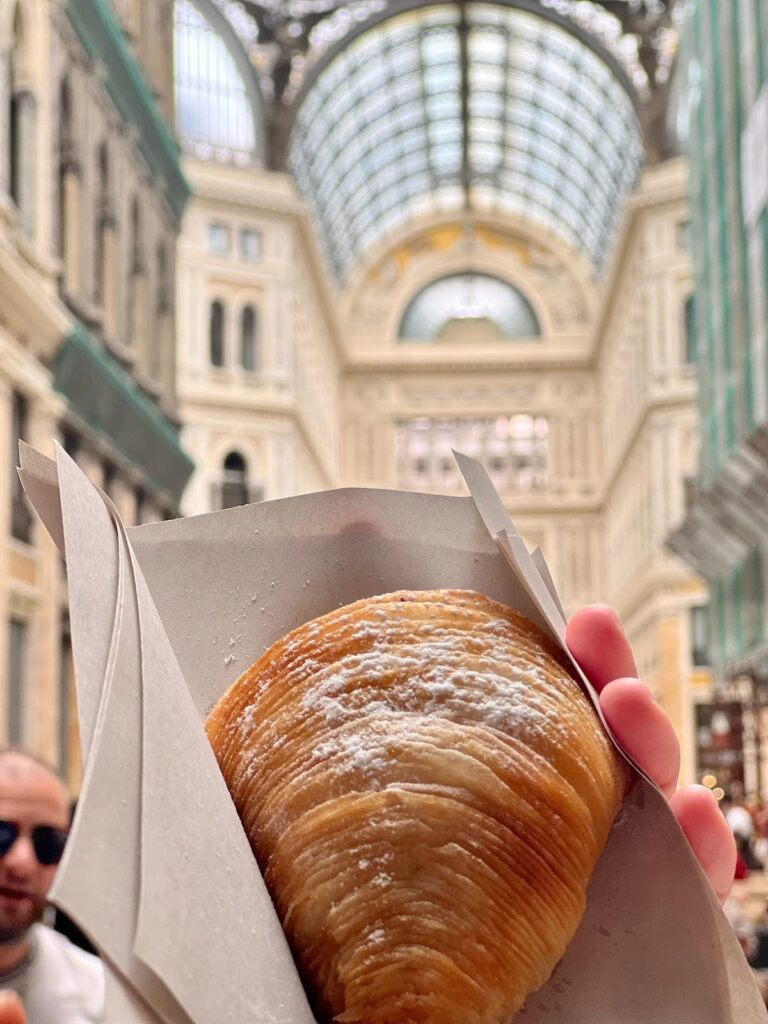 A sfogliatella pastry in the Galleria Umberto I, Naples
