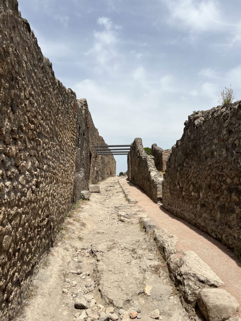 An ancient stone street among the ruins of Pompeii