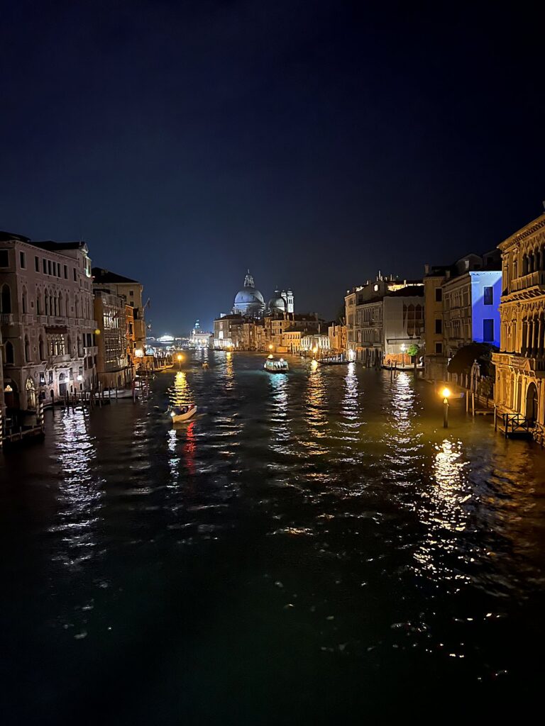 Grand Canal of Venice at night with lights reflecting on the water